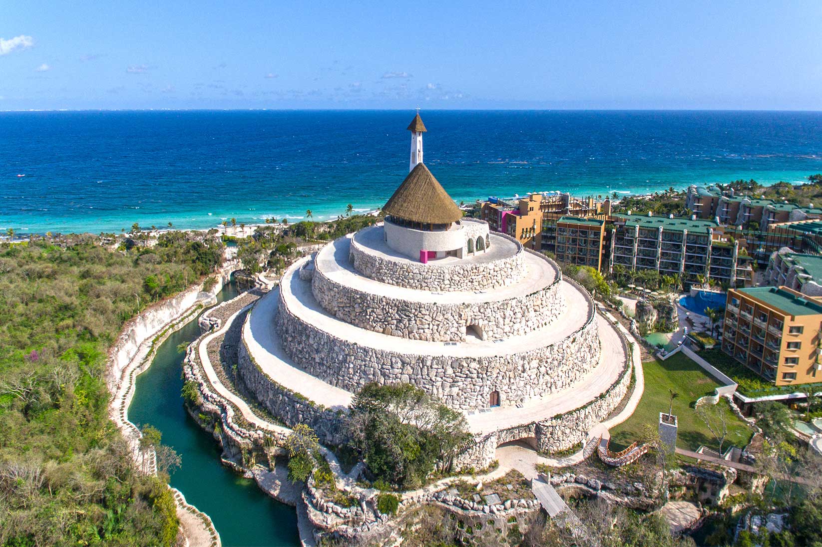 Xcaret ceremony architecture and warm natural light.